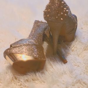 Gold spiked heels